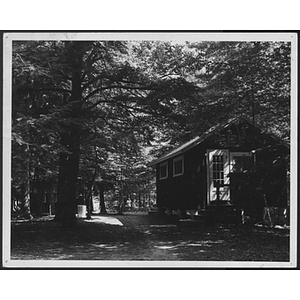 View of building and woods at unidentified YMCA camp