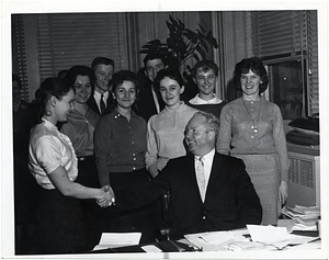 Mayor John F. Collins with unidentified people in his office