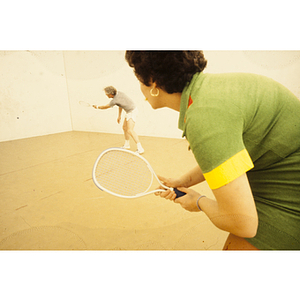 Man and woman playing racquetball
