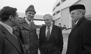 Mayor Kevin White smiling with unidentified men