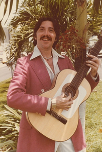A Photograph of Guillermo Knight Playing Guitar