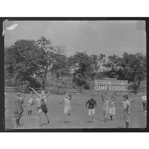 Youth running outdoors at Camp School, Allston