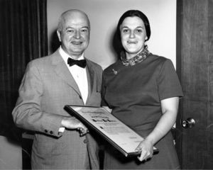 Beatrice L. Snow (AB 1962, Biology) is congratulated by Professor Edward G. Hartmann on receiving an award from the Suffolk University General Alumni Association