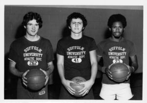 Suffolk University men's basketball players holding basketballs, 1977
