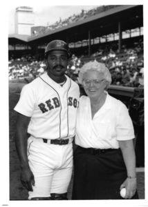 Suffolk University's Patricia I. Brown poses with Red Sox player Tony Pena