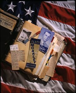 Montage featuring an American flag and a page from John Joseph Moakley's campaign scrapbook