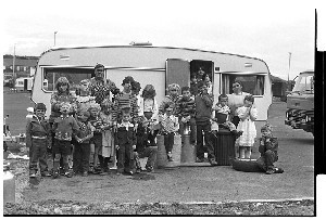 Big group of travellers (two families) at caravan in Downpatrick car-park