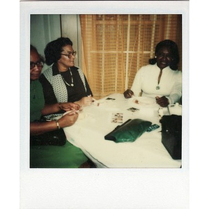 Inez Irving Hunter sits with two friends