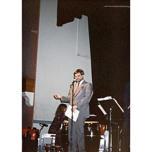 Man at the microphone during a concert at the Jorge Hernandez Cultural Center.
