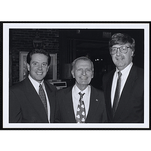 Three men posing at a St. Patrick's Day Luncheon