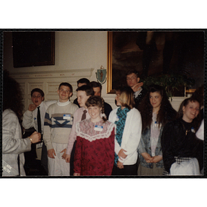 A group of boys and girls standing in front of a wall at the "Recognition Dinner at Harvard Club"