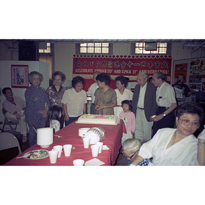 Guests and cake at a Chinese Progressive Association anniversary event