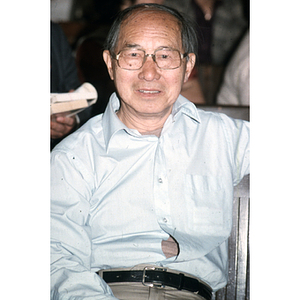 Henry Wong seated at an unidentified Chinese Progressive Association event