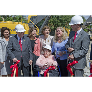 A group laughing during the groundbreaking ceremony for the George J. Kostas Research Institute for Homeland Security