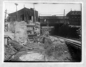 View of railroad tracks passing under a bridge