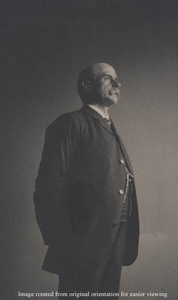 Charles Francis Adams, Jr., standing
