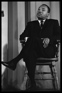 Martin Luther King, Jr., waiting to speak at the Youth, Non-Violence, and Social Change conference, Howard University