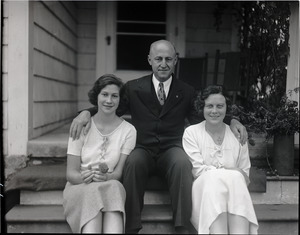 Alfred W. Ingalls and family, seated on the steps of their new home