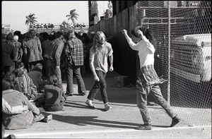 Hollywood Speedway Rock Festival: couple dancing to the music at the edge of the crowd