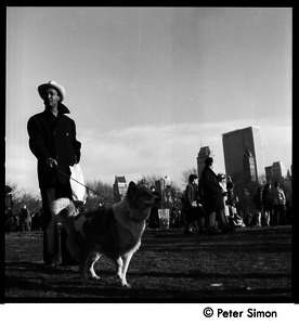 Man walking his dog at the Be-In, Central Park, New York City