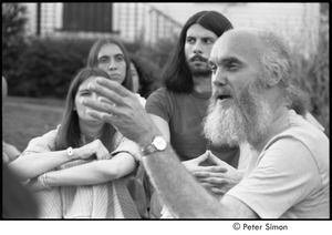 Ram Dass retreat at David McClelland's: Ram Dass speaking to group, Mirabai Bush hidden behind his hand
