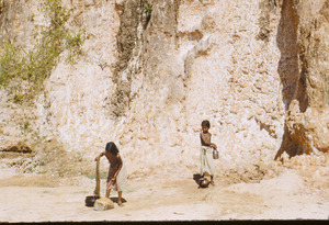 Two girls collecting water