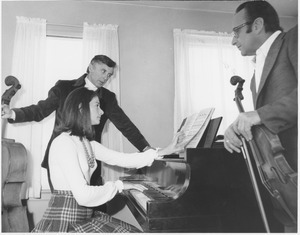 Julian and Estela Olevsky consult with an unidentifed man