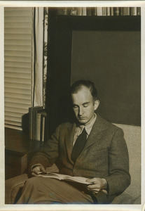 Walker W. Gibson sitting indoors