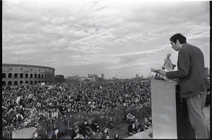 Anti-war rally at Soldier's Field, Harvard University: Howard Zinn speaking to crowd, Harvard Stadium in the background