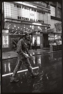 Vietnam Veterans Against the War demonstration 'Search and destroy': veteran (W. B. Mabrin?) marching past State Theater, Combat Zone