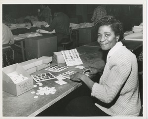 Woman packaging buttons