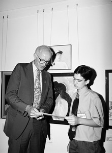Congressman John W. Olver (center) presenting an award for creative merit to Noah Sparkes