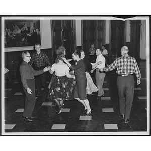 Adults performing a square dance