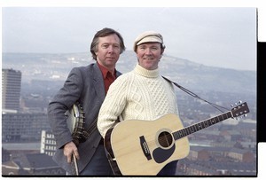 Liam Clancy and Tommy Makem singers and recording artists, on the roof of the Europa Hotel, Belfast