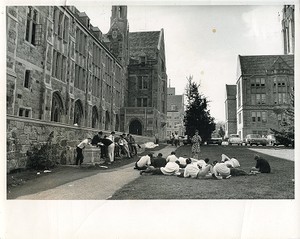 Devlin Hall exterior: side view with students on grass