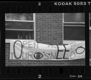 Photographs of signs promoting need-blind admissions policies, October 1991