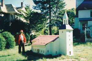 My dad in front of a scale model he built in his 90s