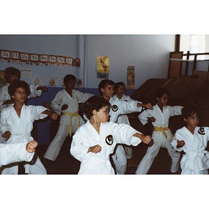 Class of young Latino boys performing a karate demonstration at the Festival Betances, Boston, 1986