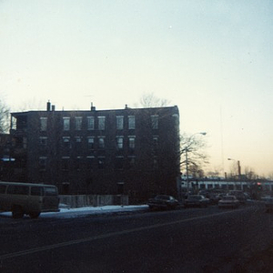 An unidentified street in Roxbury, with a four-story apartment building in the background