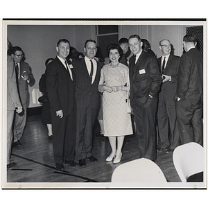 William J. Lynch, second from left, posing with three unidentified people at a Boys' Club event