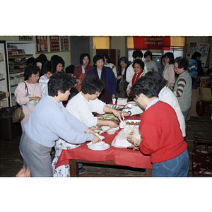 Guests eating at an International Women's Day event