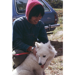 Man and dog at an apple orchard