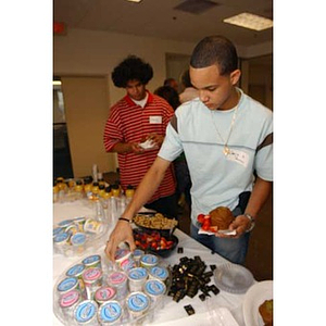 Odalis David Polanco gets breakfast at the Torch Scholars Orientation