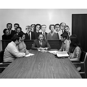 Dean Norman Rosenblatt sits at a table with students from the College of Criminal Justice