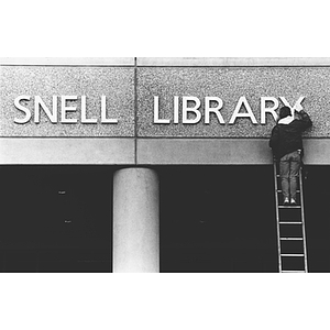 Completion of the lettering on Snell Library