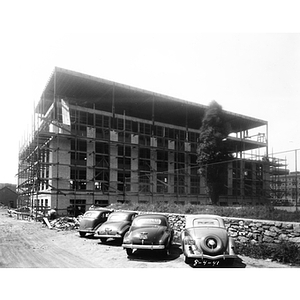 Cars parked in front of Mugar Life Sciences Building during construction