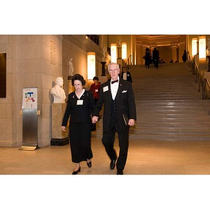 A couple walks through the Museum of Fine Arts at President Aoun's inauguration celebration
