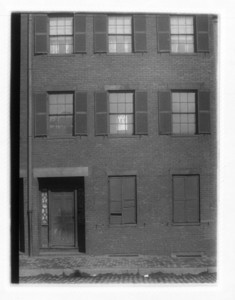 View of windows and a door, with a drainpipe on the left side