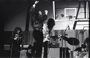 Unidentified band in performance in what appears to be a high school gymnasium