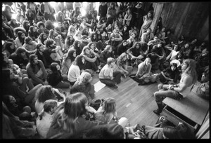 Michael Metelica addressing a crowd of commune members at a meeting inside the Brotherhood of the Spirit dormitory, Warwick, Mass. (view from above)